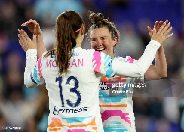 Alex Morgan of the San Diego Wave FC is congratulated by teammate Savannah McCaskill after Morgan scored a goal during the second half of the 2024...