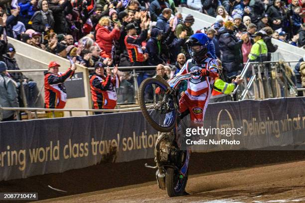 Brady Kurtz from Australia is celebrating his win with a wheelie at the Peter Craven Memorial Trophy meeting at the National Speedway Stadium in...