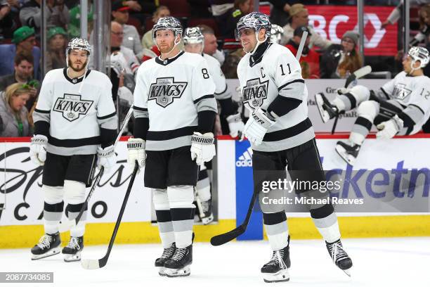 Vladislav Gavrikov and Anze Kopitar of the Los Angeles Kings celebrate after defeating the Chicago Blackhawks at the United Center on March 15, 2024...