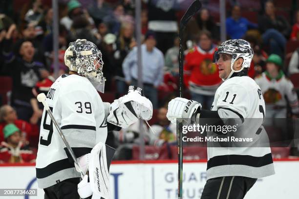 Cam Talbot and Anze Kopitar of the Los Angeles Kings celebrate after defeating the Chicago Blackhawks at the United Center on March 15, 2024 in...