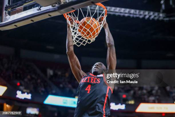 Jay Pal of the San Diego State Aztecs dunks the ball against the Utah State Aggiesduring the second half of a semifinal game of the Mountain West...