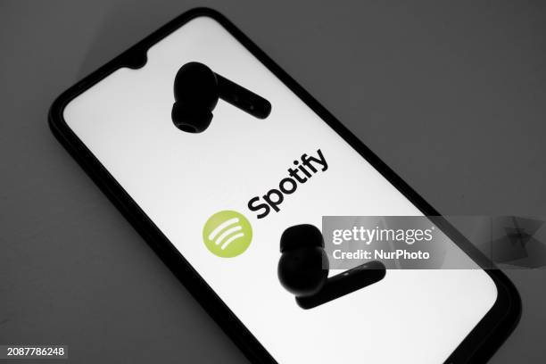 The Spotify logo is displayed on a smartphone screen in Athens, Greece, on March 19, 2024.