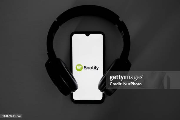 The Spotify logo is displayed on a smartphone screen in Athens, Greece, on March 19, 2024.