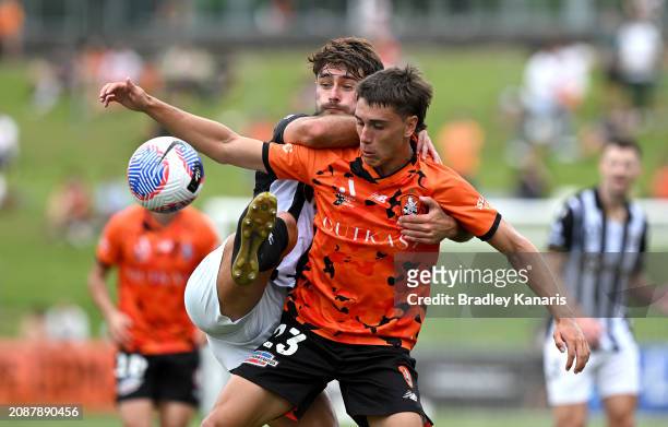 Keegan Jelacic of the Roar and Ivan Vujica of Macarthur FC challenge for the ball during the A-League Men round 21 match between the Brisbane Roar...