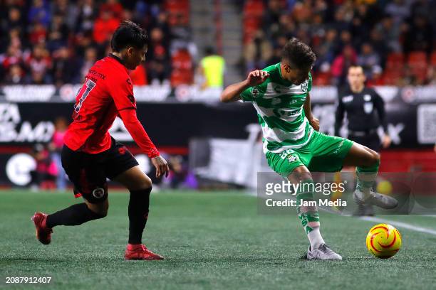 Domingo Blanco of Tijuana fights for the ball with Ramiro Sordo of Santos during the 12th round match between Tijuana and Santos Laguna as part of...