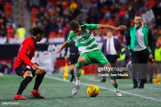 Domingo Blanco of Tijuana fights for the ball with Ramiro Sordo of Santos during the 12th round match between Tijuana and Santos Laguna as part of...