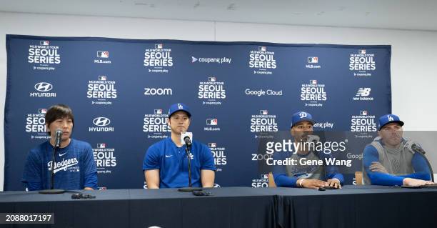 Interpreter Ippei Mizuhara, Shohei Ohtani, Mookie Betts and Freddie Freeman of the Los Angeles Dodgers talk during a press conference ahead of the...