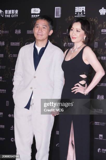 Actor Tony Leung Chiu-wai and his wife actress Carina Lau Kar-ling pose at the red carpet of 2024 annual Hong Kong Film Directors' Guild Awards on...