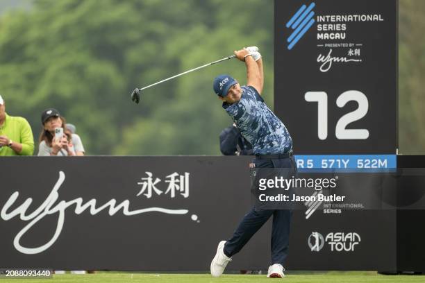 Patrick Reed of the United States tees off on hole 12 during the third round of International Series Macau at Macau Golf and Country Club on March...