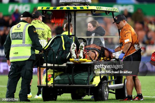 Anton Lienert-Brown of the Chiefs is taken off after an injury during the round four Super Rugby Pacific match between Chiefs and Fijian Drua at FMG...