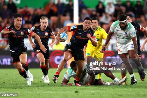 Anton Lienert-Brown of the Chiefs makes a break during the round four Super Rugby Pacific match between Chiefs and Fijian Drua at FMG Stadium...