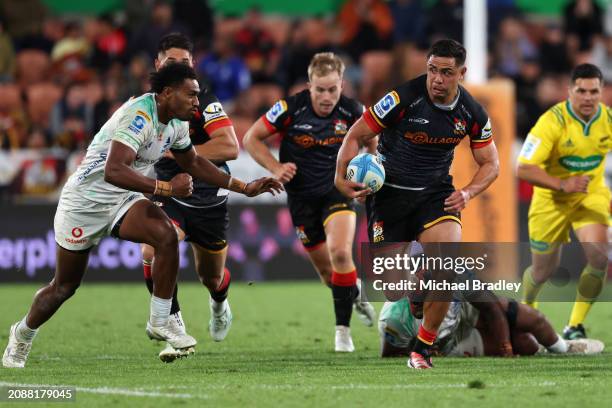 Anton Lienert-Brown of the Chiefs makes a break during the round four Super Rugby Pacific match between Chiefs and Fijian Drua at FMG Stadium...