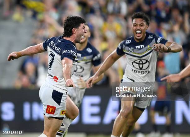 Chad Townsend of the Cowboys celebrates after kicking the winning field goal in extra time during the round two NRL match between North Queensland...