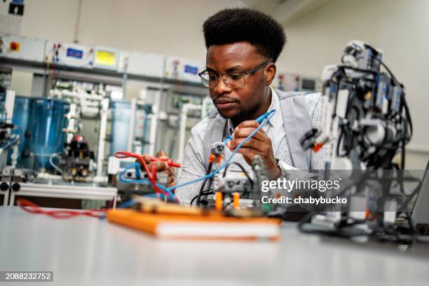 engineer works in mechatronic laboratory - poc engineer stock pictures, royalty-free photos & images