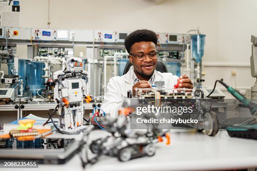 Electronic engineer developing new robot in laboratory Electronic engineer developing new robot in laboratory