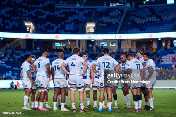 Blues players huddle during the round four Super Rugby Pacific match between NSW Waratahs and Blues at Allianz Stadium, on March 16 in Sydney,...