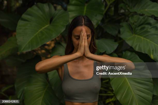 young woman performs breathing exercises - image focus technique stock pictures, royalty-free photos & images