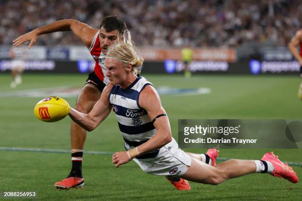 Riley Bonner of the Saints competes with Oliver Dempsey of the Cats during the round one AFL match between Geelong Cats and St Kilda Saints at GMHBA...