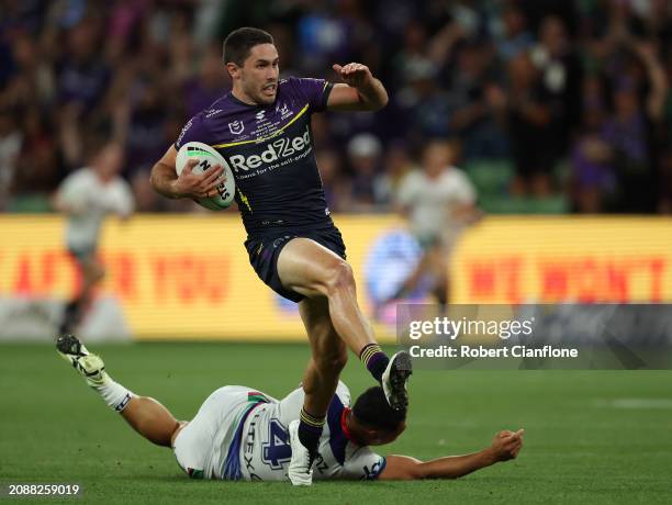 Nick Meaney of the Storm makes a break on his way to scoring during the round two NRL match between Melbourne Storm and New Zealand Warriors at AAMI...