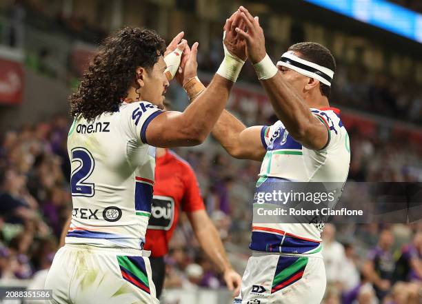 Dallin Watene-Zelezniak of the Warriors celebrates after scoring a try during the round two NRL match between Melbourne Storm and New Zealand...