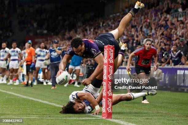 Xavier Coates of the Storm scores the match winning try during the round two NRL match between Melbourne Storm and New Zealand Warriors at AAMI Park,...