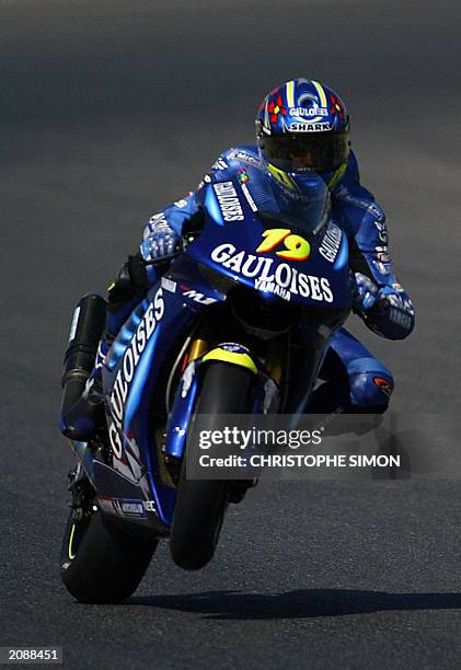 French Olivier Jacque accelerates during the free practice of the Moto Grand Prix of Catalunya in Montmelo race track 13 June 2003 . AFP Photo...