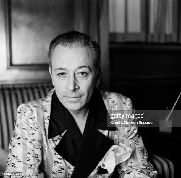 American actor and dancer George Raft, wearing patterned loungewear with black lapels, 7th January 1948.