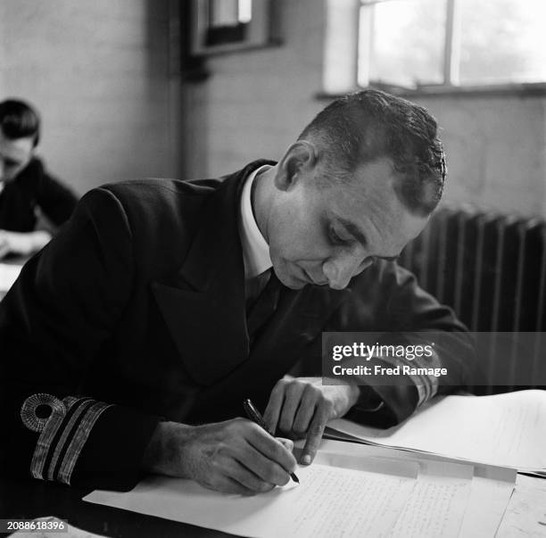 Indian naval officer Lieutenant-Commander Norman Warner during a class at HMS Collingwood, Western Europe's largest naval training organisation, in...