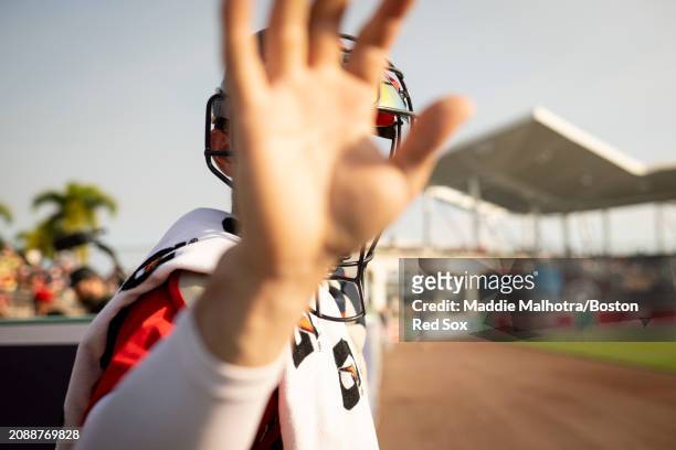 Connor Wong of the Boston Red Sox walks out of the bullpen before a game against the Minnesota Twins at JetBlue Park at Fenway South on March 15,...