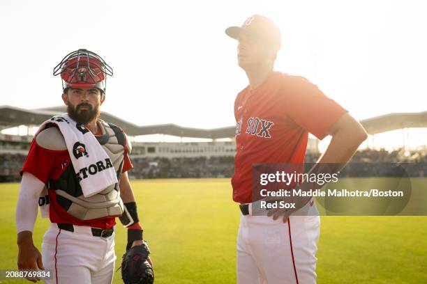 Connor Wong of the Boston Red Sox and Garrett Whitlock of the Boston Red Sox walk out of the bullpen before a game against the Minnesota Twins at...