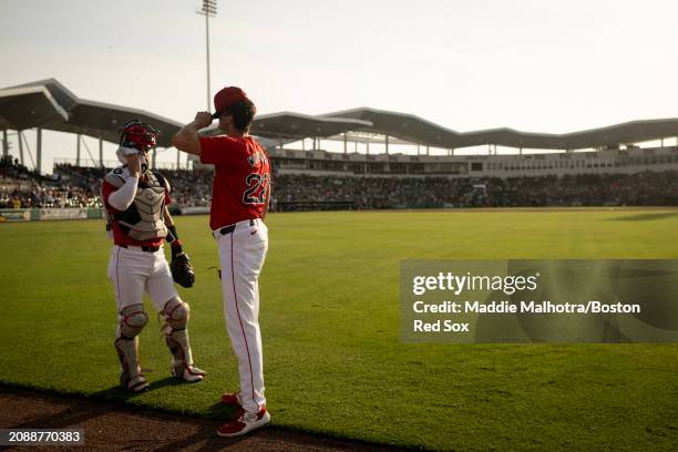 Connor Wong of the Boston Red Sox and Garrett Whitlock of the Boston Red Sox walk out of the bullpen before a game against the Minnesota Twins at...