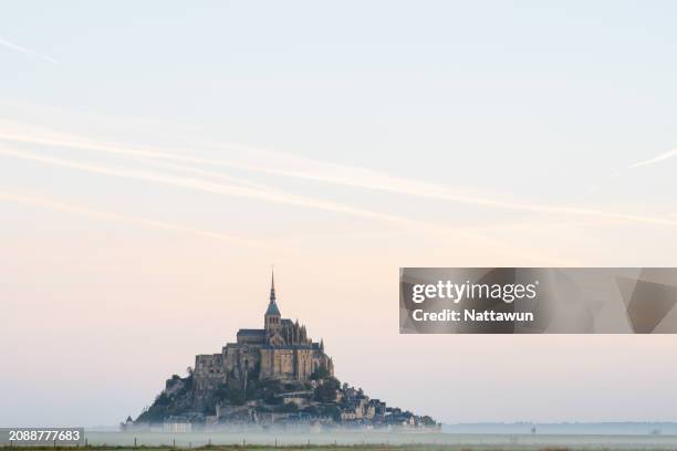 beautiful landscape view at the morning with foggy and mont saint michel. - lamb island stock pictures, royalty-free photos & images