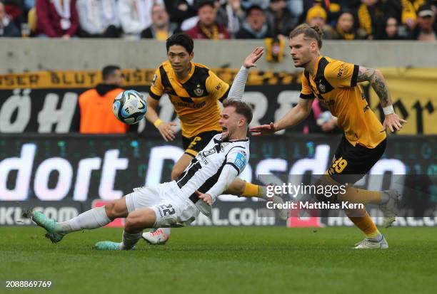Leonardo Weschenfelder Scienza of Ulm challenges for the ball with Kevin Ehlers of Dresden during the 3. Liga match between Dynamo Dresden and SSV...