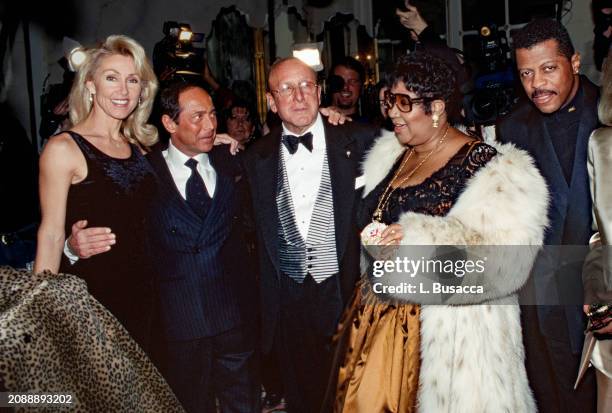 Canadian American singer songwriter Paul Anka with wife Anne de Zogheb, American music executive and producer Clive Davis, American soul singer...