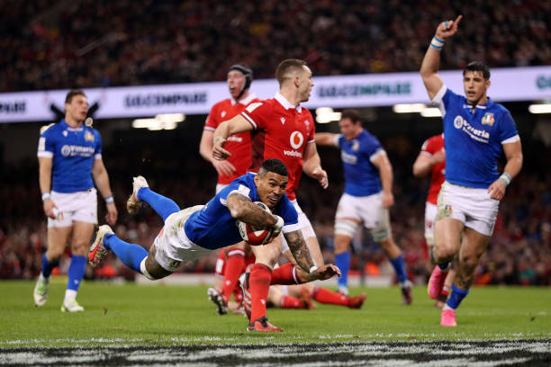 Monty Ioane of Italy dives in to score his team's first try during the Guinness Six Nations 2024 match between Wales and Italy at the Principality...