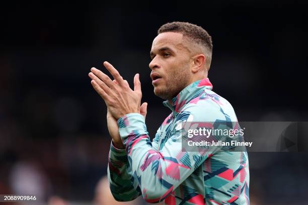 Carlton Morris of Luton Town applauds the fans during the warm up prior to the Premier League match between Luton Town and Nottingham Forest at...