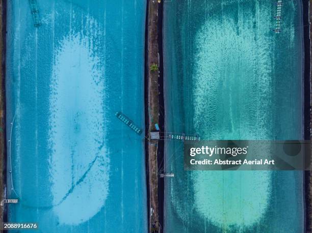 drone image looking down on two desalination ponds, vietnam - reverse osmosis stock pictures, royalty-free photos & images