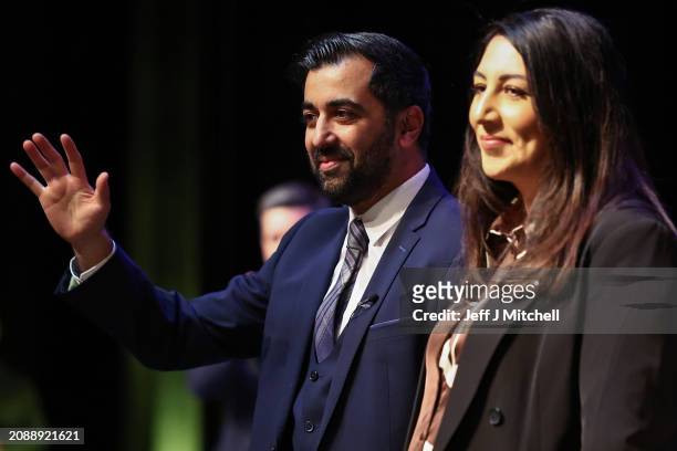First Minister Humza Yousaf and his wife Nadia El-Nakla acknowledge applause following his speech at the SNP Campaign Council on March 16, 2024 in...