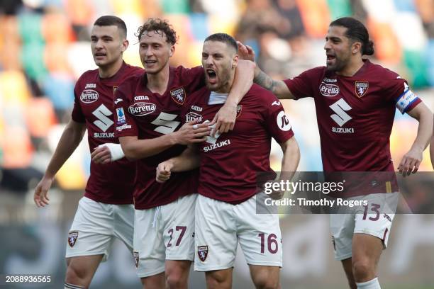 Nikola Vlasic of Torino celebrates scoring a goal with teammates during the Serie A TIM match between Udinese Calcio and Torino FC at Bluenergy...