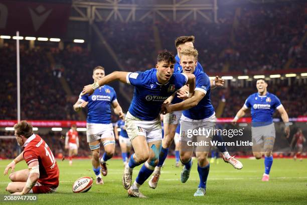 Lorenzo Pani of Italy celebrates scoring his team's second try during the Guinness Six Nations 2024 match between Wales and Italy at Principality...