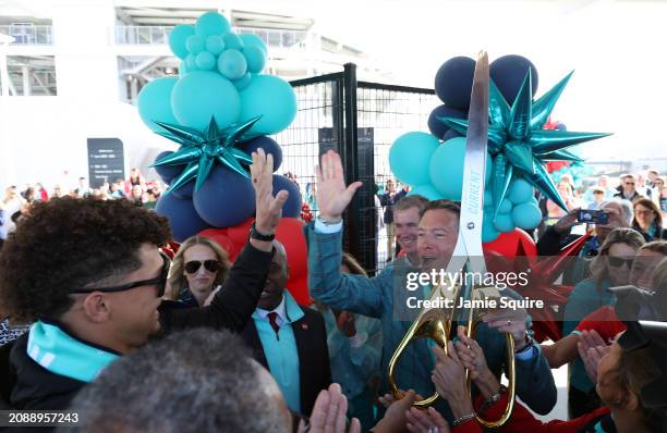 Chairman, CEO and Portfolio Manager Chris Long high-fives co-owner Patrick Mahomes as Brittany Mahomes and Kansas City Mayor Quinton Lucas look on at...