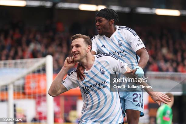 Chris Wood of Nottingham Forest celebrates scoring his team's first goal with teammate Anthony Elanga during the Premier League match between Luton...