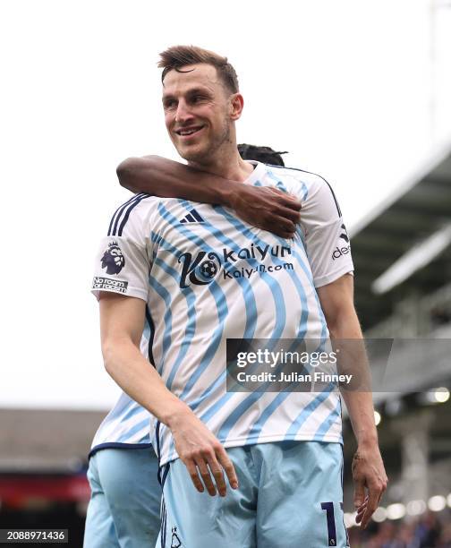 Chris Wood of Nottingham Forest celebrates scoring his team's first goal during the Premier League match between Luton Town and Nottingham Forest at...