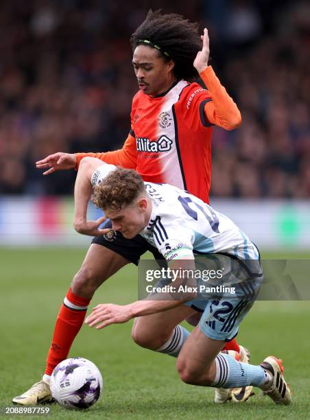 Ryan Yates of Nottingham Forest is tackled by Tahith Chong of Luton Town during the Premier League match between Luton Town and Nottingham Forest at...