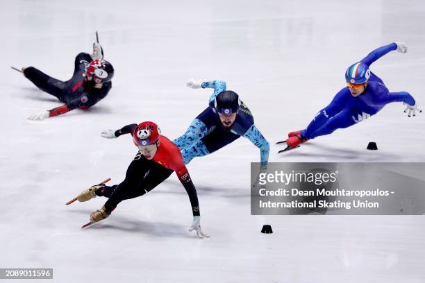 Xiaojun Lin of China, Denis Nikisha of Kazakhstan, Jordan Piaerre-Gilles of Canada and Steven Dubois of Canada slides off as they compete in the Men...