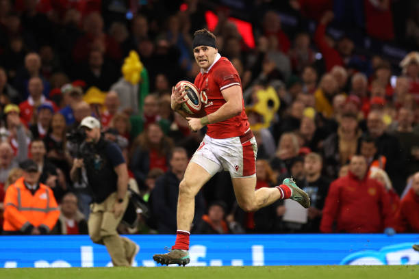 Mason Grady of Wales makes a break to score the team's third try during the Guinness Six Nations 2024 match between Wales and Italy at Principality...