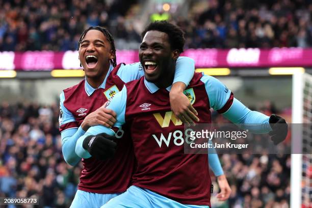 Datro Fofana of Burnley celebrates scoring his team's second goal with teammate Wilson Odobert during the Premier League match between Burnley FC and...
