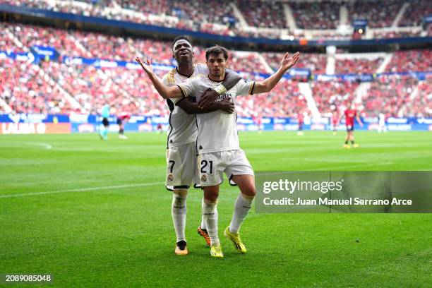 Brahim Diaz of Real Madrid celebrates scoring his team's third goal with teammate Vinicius Junior during the LaLiga EA Sports match between CA...