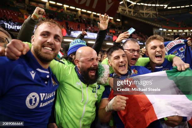 Niccolo Cannone, Juan Ignacio Brex and Lorenzo Cannone of Italy celebrate with fans following the team's victory during the Guinness Six Nations 2024...