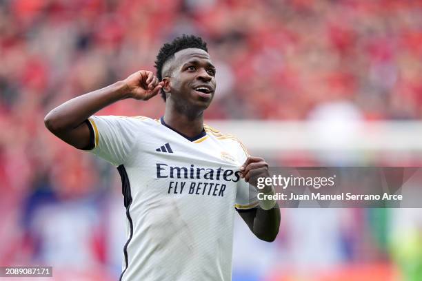 Vinicius Junior of Real Madrid celebrates scoring his team's fourth goal during the LaLiga EA Sports match between CA Osasuna and Real Madrid CF at...